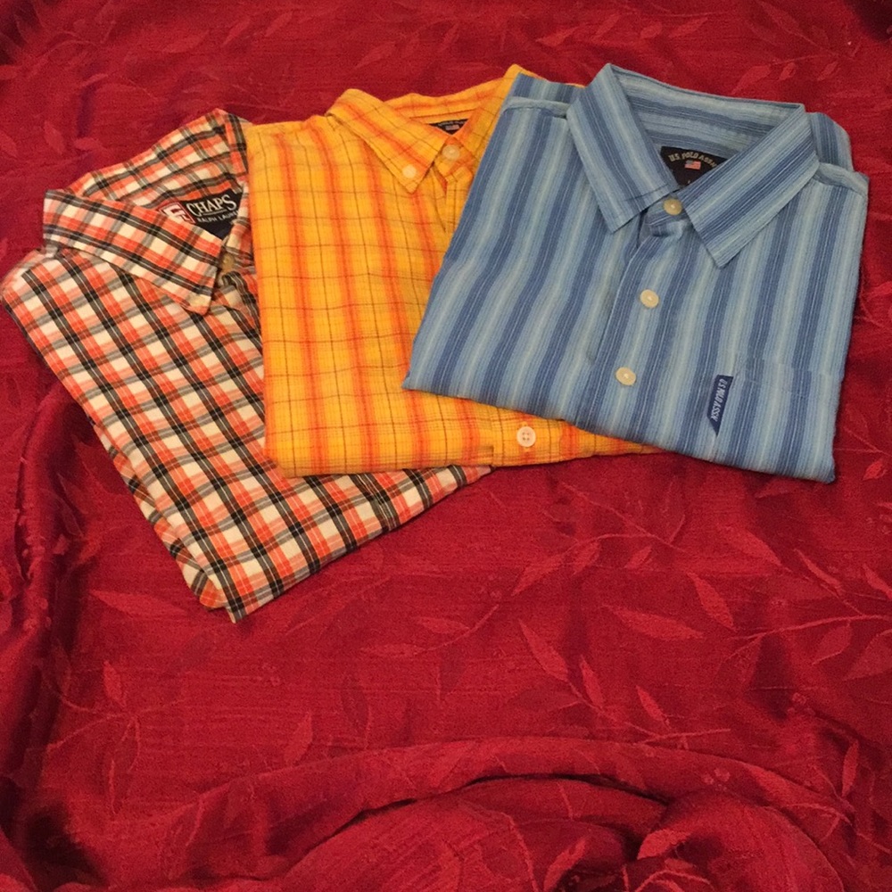 A set of three young man shirts.